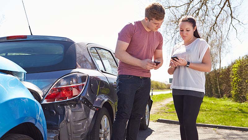 Man and woman following proper steps after an auto accident