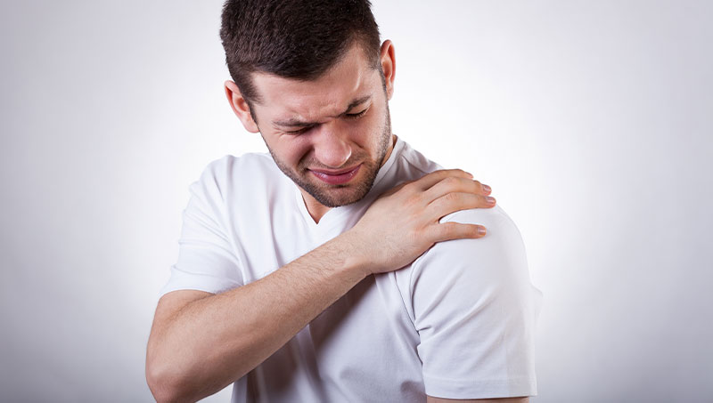 Man suffering with frozen shoulder