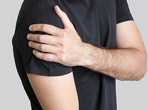 Man suffering with frozen shoulder